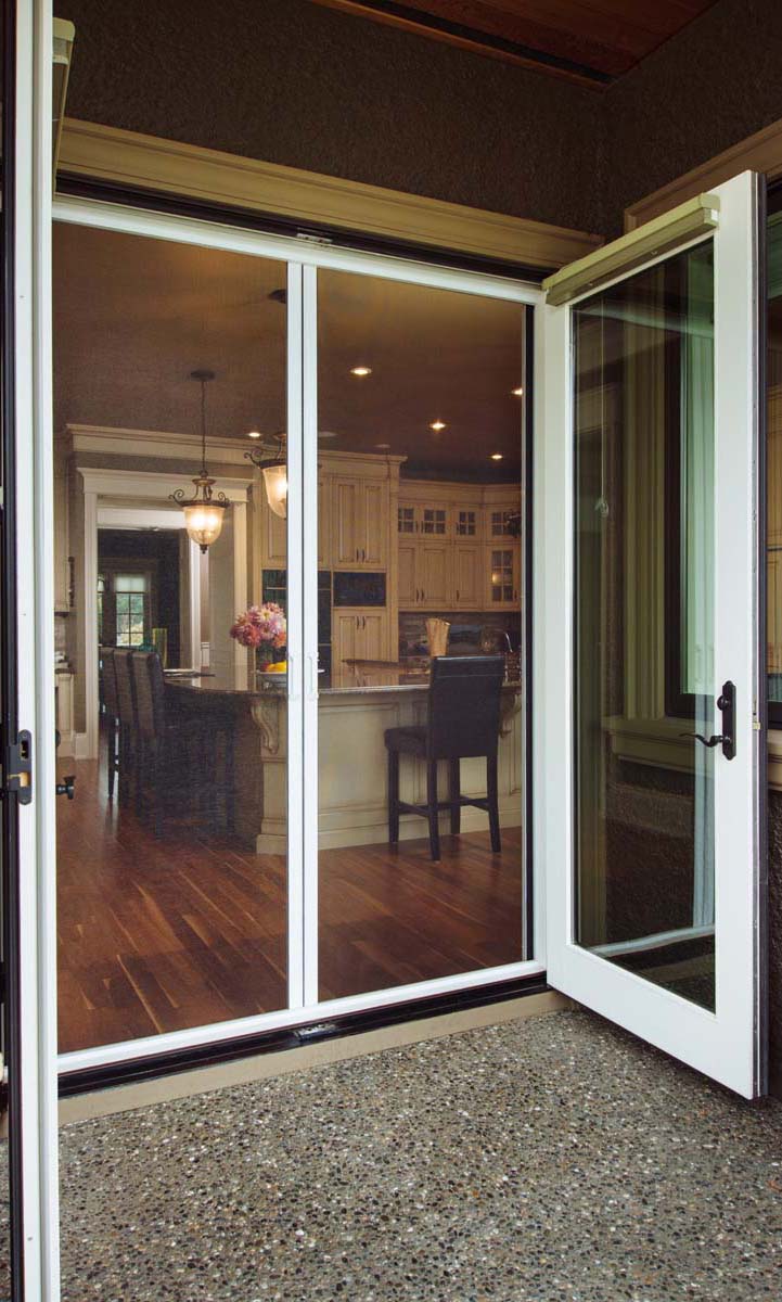 Family in front of window looking out at the landscape